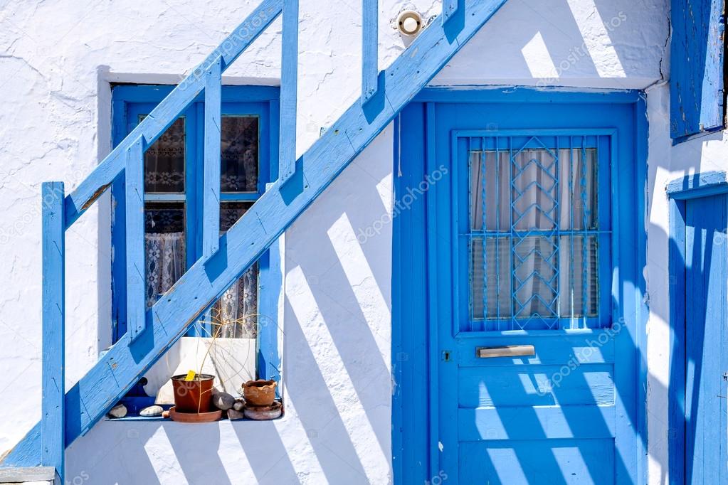Traditional doors and windows in Greek white and blue style