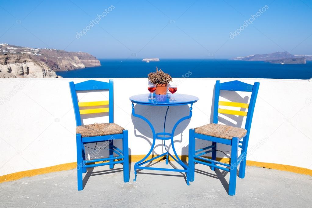 Blue chairs and table on a mediterranean balcony with nice view