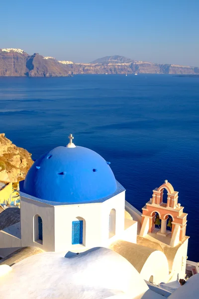 Scenic view of white houses and blue dome in Santorini Royalty Free Stock Images