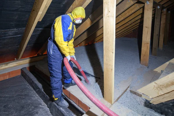 Insulation of the attic with cellulose insulation. Spraying from a hose — Stock Photo, Image