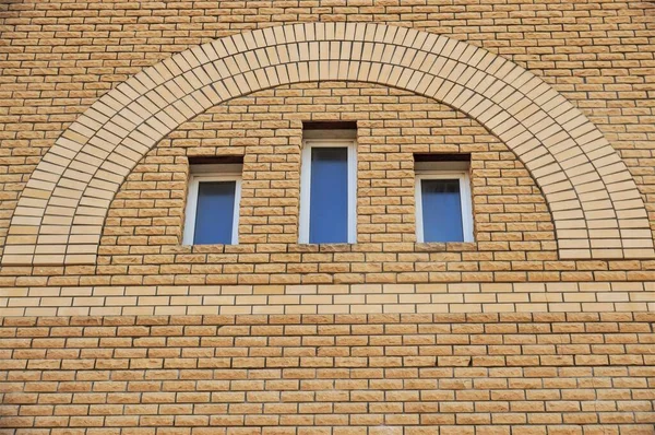 view of the wall of a brick house with an interesting design
