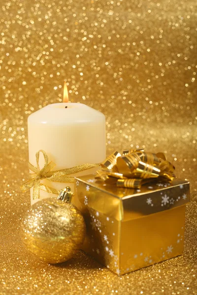 Beautiful christmas candle on golden glitter background with copy space — Stock Photo, Image