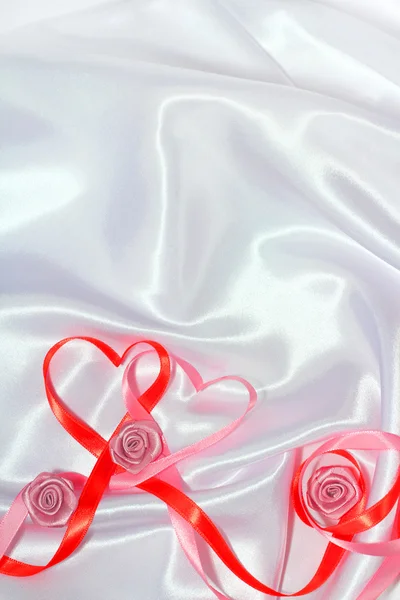 Red ribbon hearts — Stock Photo, Image
