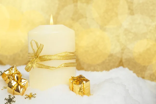 Christmas candle on snow — Stock Photo, Image