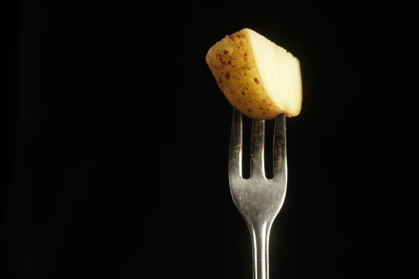 Potato on fork — Stock Photo, Image