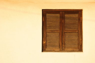 Window with wooden shutters. clipart