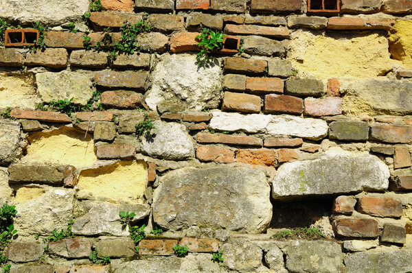 Part of ramshackle wall in Verona, the city of Romeo and Juliet. Italy.