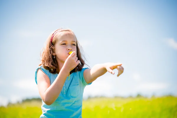 Child blowing whistle — Stock Photo, Image