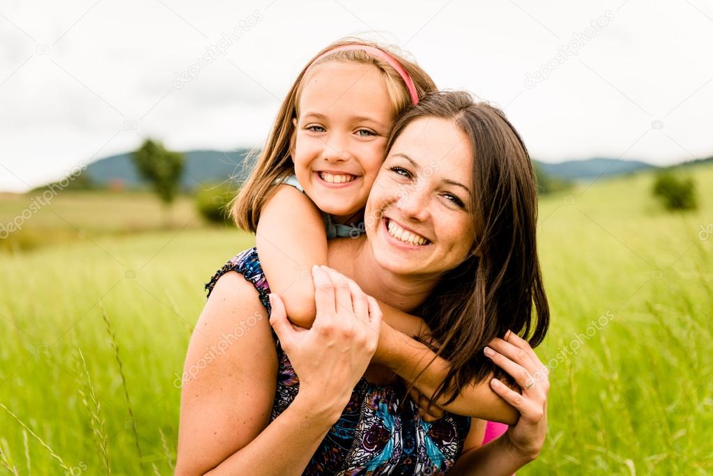 Mother and child hugging