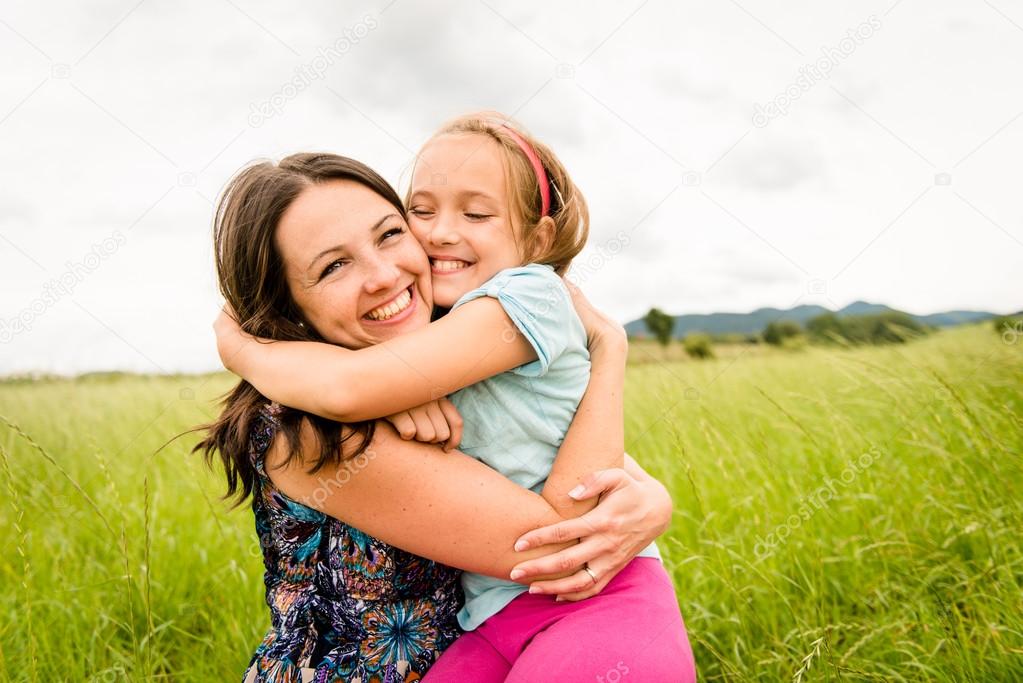 Mother and child hugging — Stock Photo © martinan #53085803