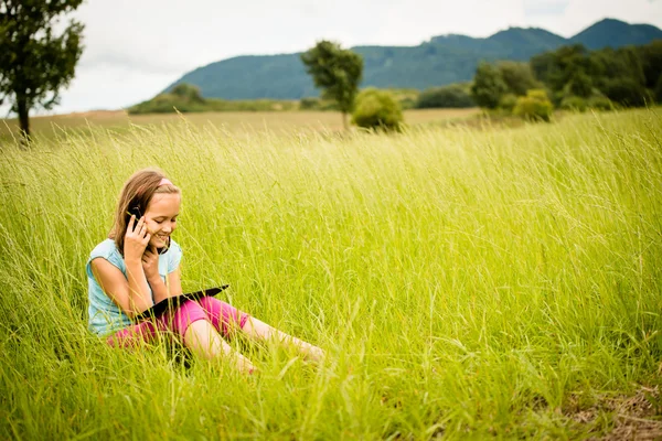 Mobility -  watching tablet and calling phone — Stock Photo, Image