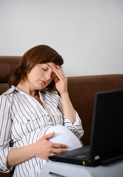 Tired working pregnant woman — Stock Photo, Image