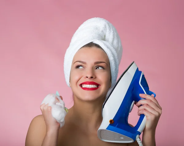 Beautiful woman with a iron — Stock Photo, Image