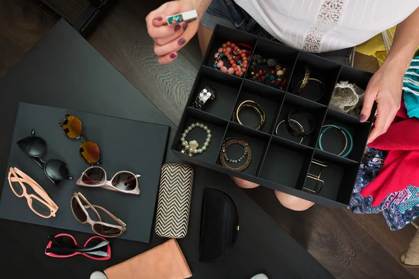 Woman with a box of accessories — Stock Photo, Image