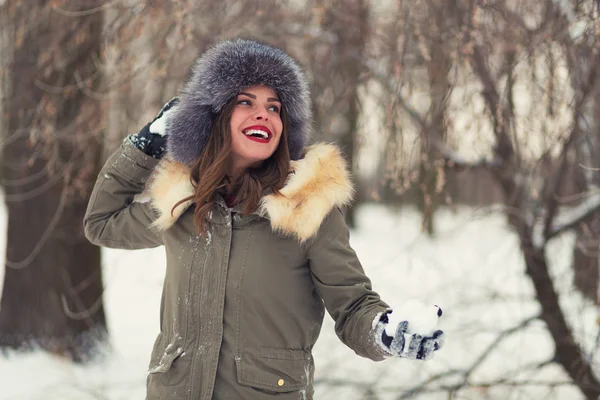 Beautiful woman in winter coat and fur hat — Stock Photo, Image