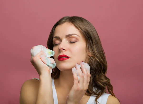 Beautiful woman with a cleansing foam — Stock Photo, Image