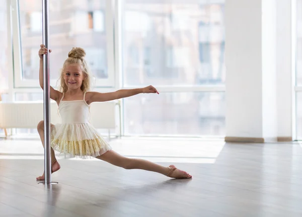 Beautiful little dancer in a dance studio