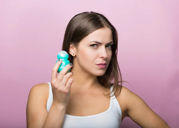 Woman with a deodorant — Stock Photo, Image