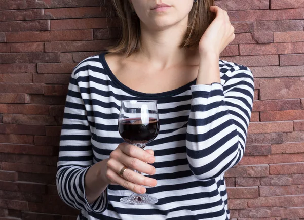 Holding a glass of wine — Stock Photo, Image