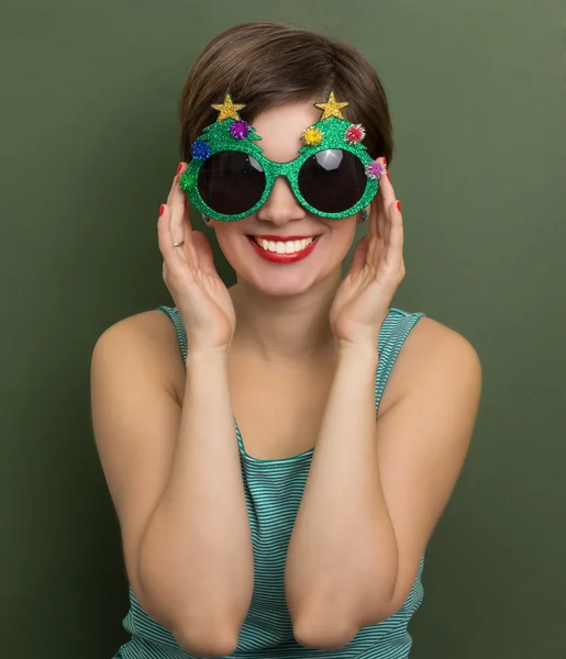 Beautiful woman with Christmas party glasses — Stock Photo, Image