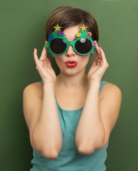 Beautiful woman with Christmas party glasses — Stock Photo, Image