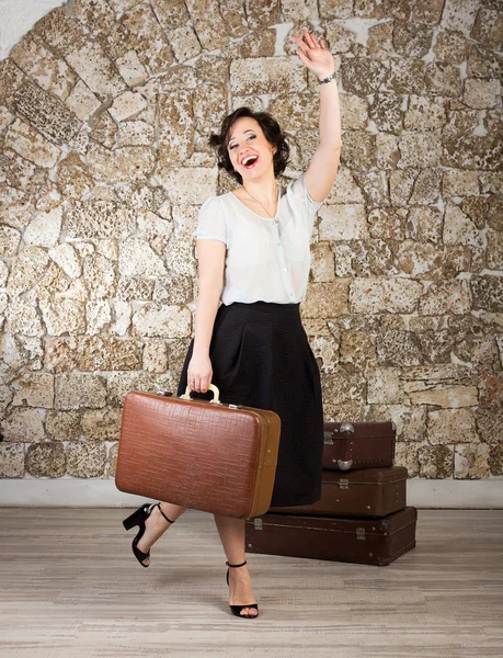 Beautiful woman with suitcases — Stock Photo, Image