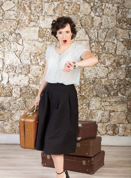 Beautiful woman with suitcases — Stock Photo, Image