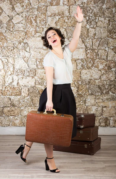 Beautiful woman with suitcases — Stock Photo, Image