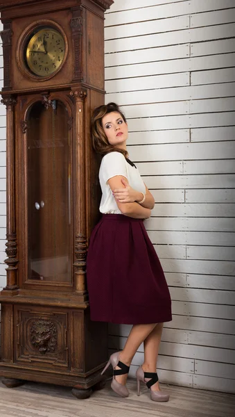 Beautiful woman rewinding the clock — Stock Photo, Image