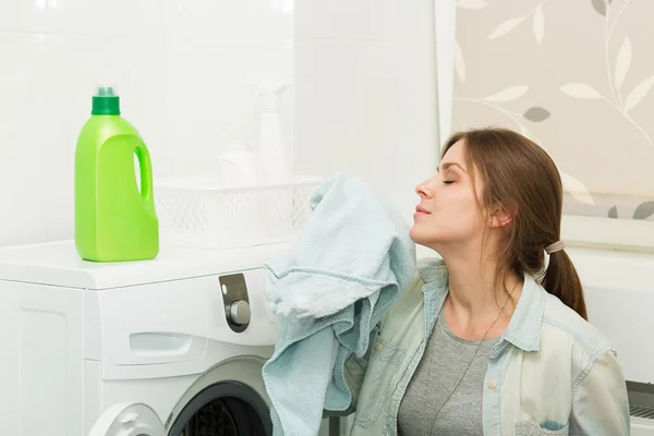Beautiful girl doing laundry — Stock Photo, Image