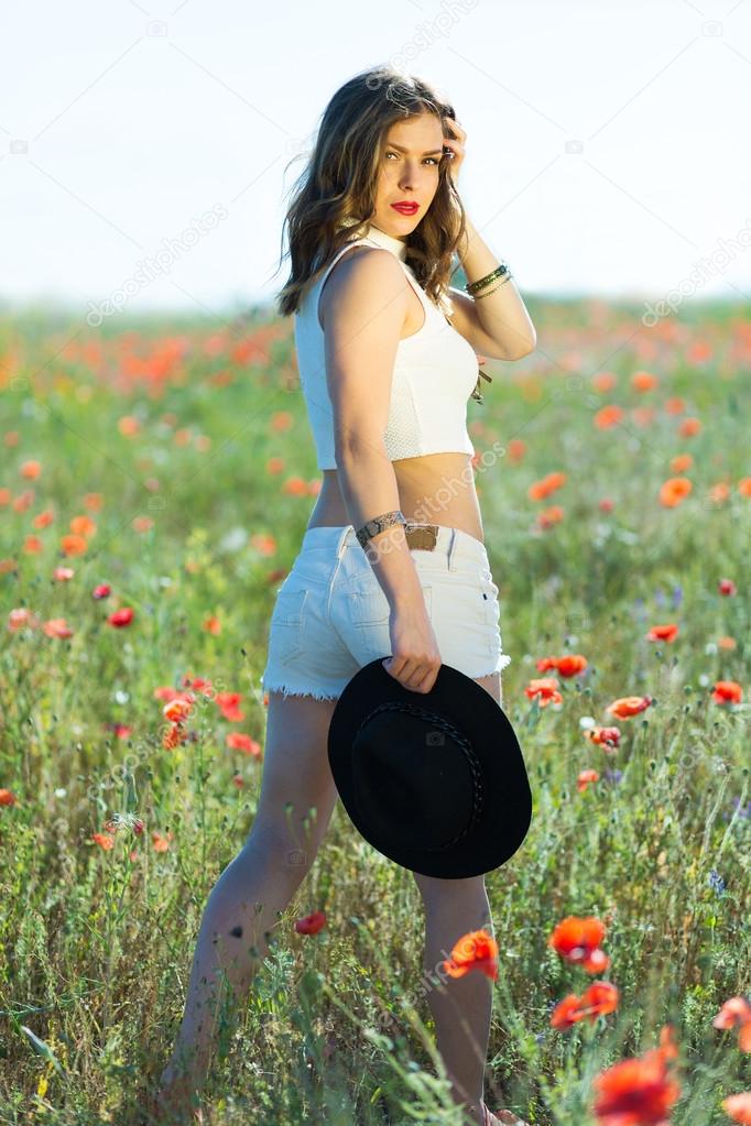 Beautiful girl in a summer field