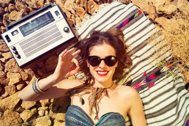 Beautiful girl on a stony beach