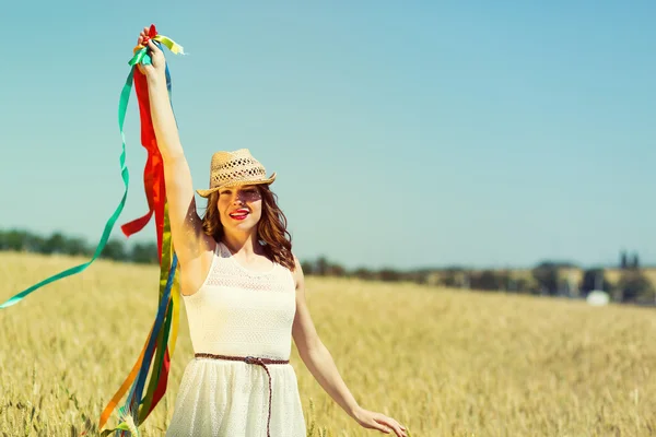 Happy girl holding colorful ribbons — Stok fotoğraf