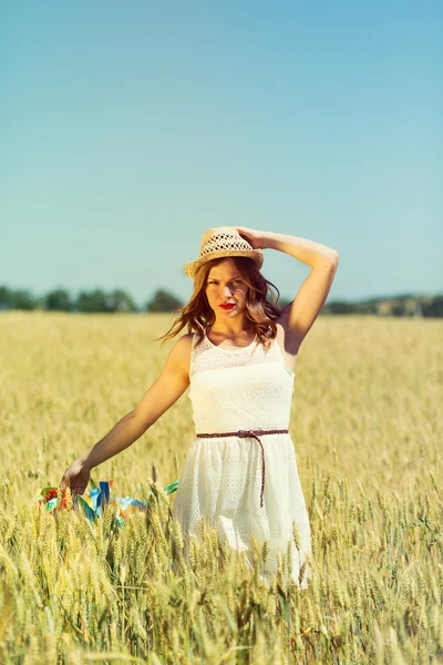 Happy girl holding colorful ribbons — ストック写真