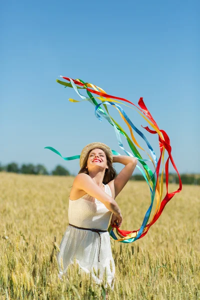 Щаслива дівчина тримає барвисті стрічки Стокове Зображення