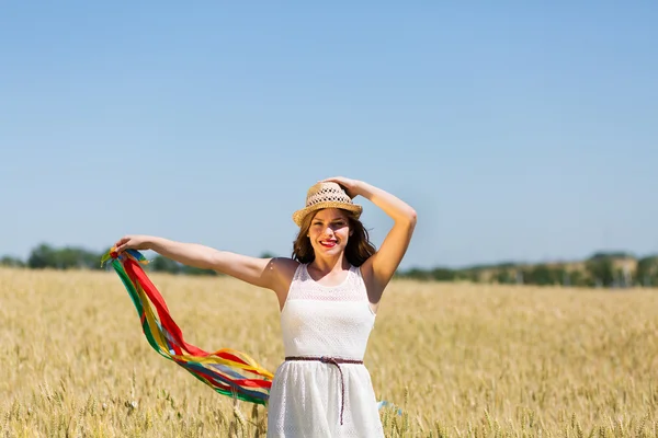 Happy girl holding colorful ribbons — Stok fotoğraf
