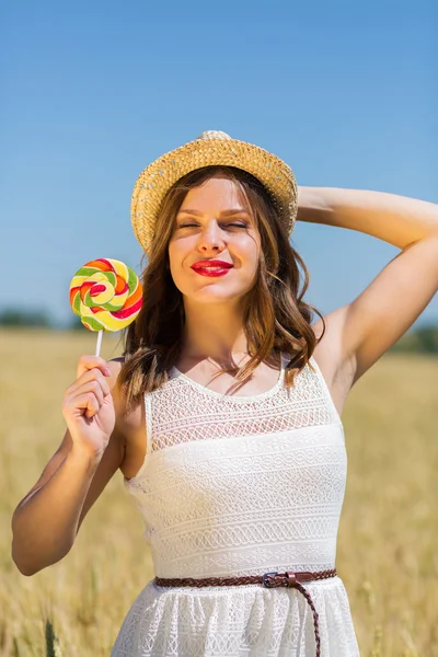 Happy girl with a candy — Stok fotoğraf