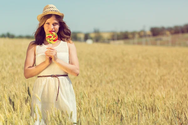 Happy girl with a candy — ストック写真