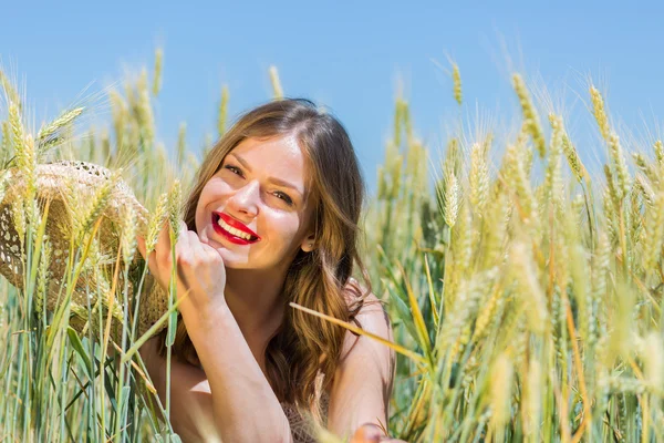 Happy girl in the summer field