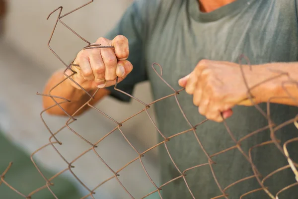 Breaking down the fence — ストック写真