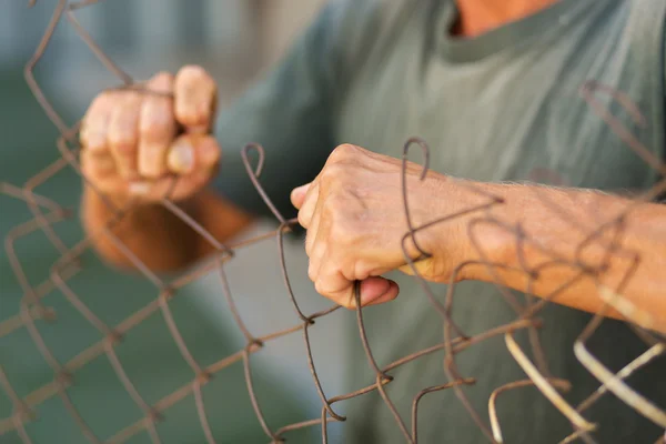 Breaking down the fence — ストック写真