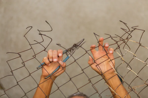 Breaking down the fence — Stock Photo, Image
