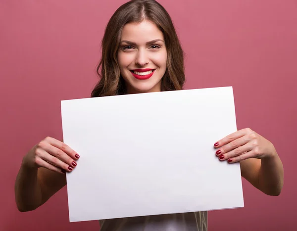 Beautiful woman holding a banner — Stock Photo, Image