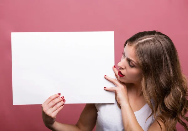 Beautiful woman holding a banner — Stock Photo, Image