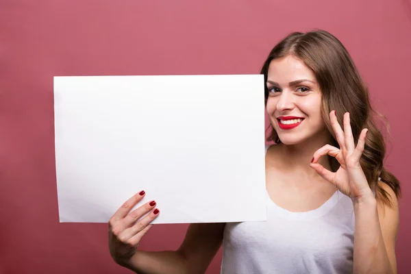 Beautiful woman holding a banner — Stock Photo, Image