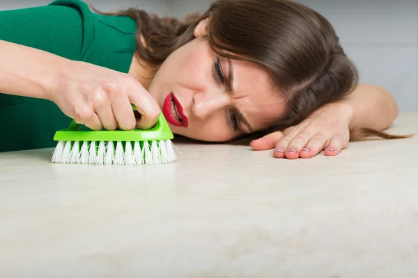 Woman cleaning up her kitchen