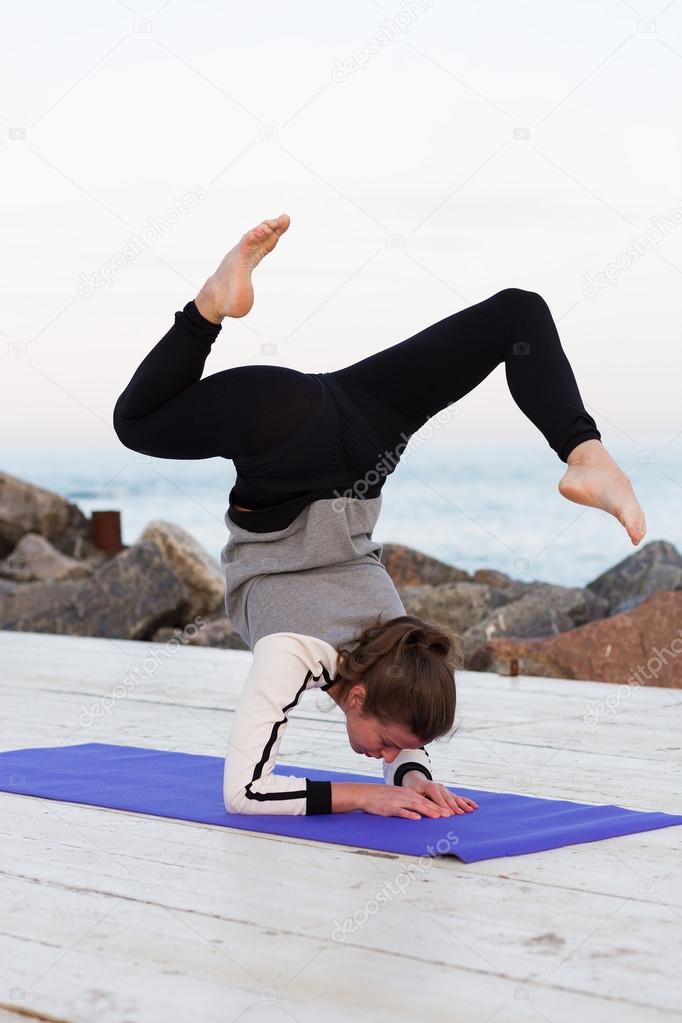 Sportive woman practicing yoga