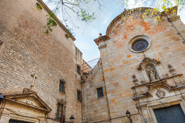 Facade of the church and Placa Square de Sant Felip Neri in Barcelona in Gothic district
