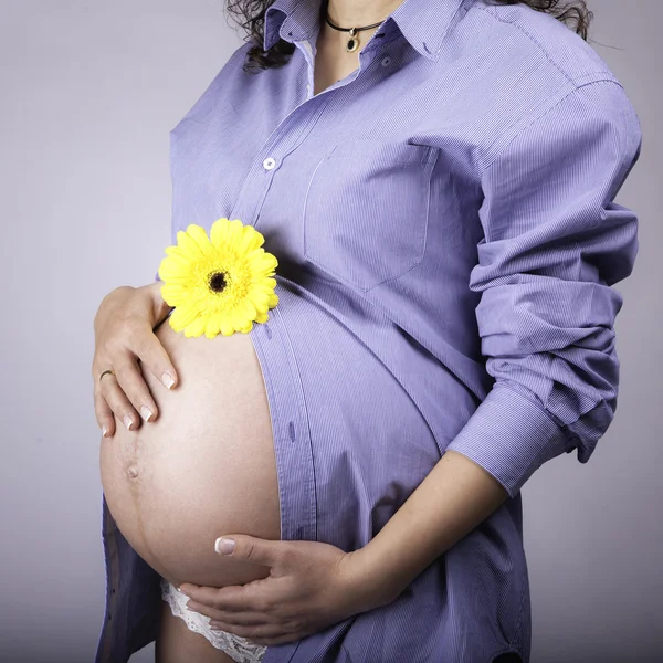 Pregnant Woman holding her hands on baby bump — Stock Photo, Image