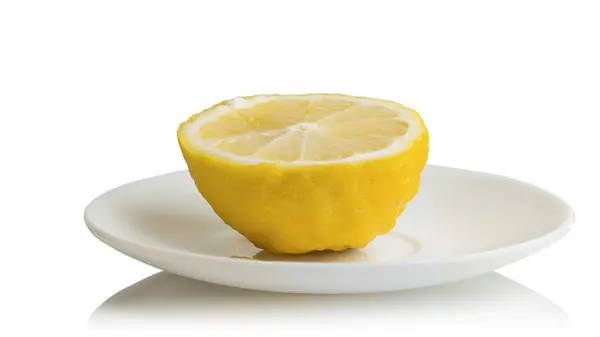 Half lemon on a saucer — Stock Photo, Image